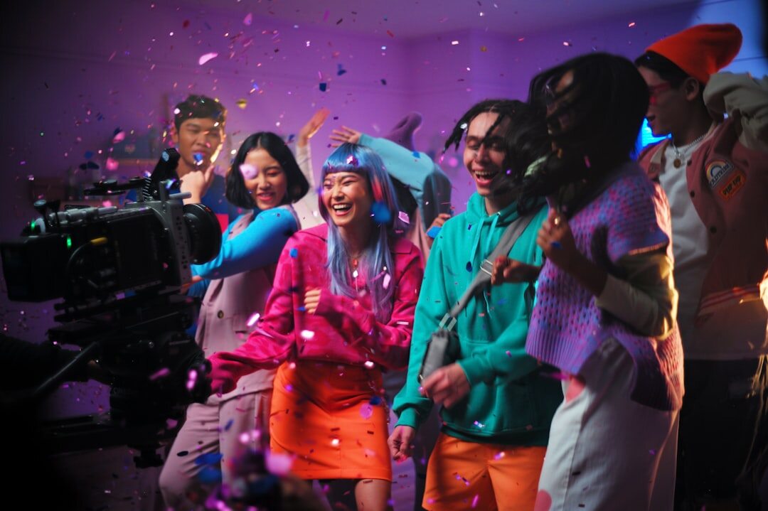 Broadcast production crew celebrating together on a television set